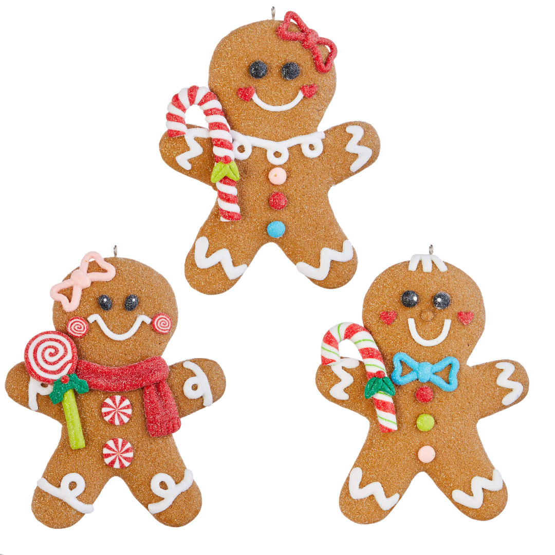 Three gingerbread man ornaments with candy decorations on a white background