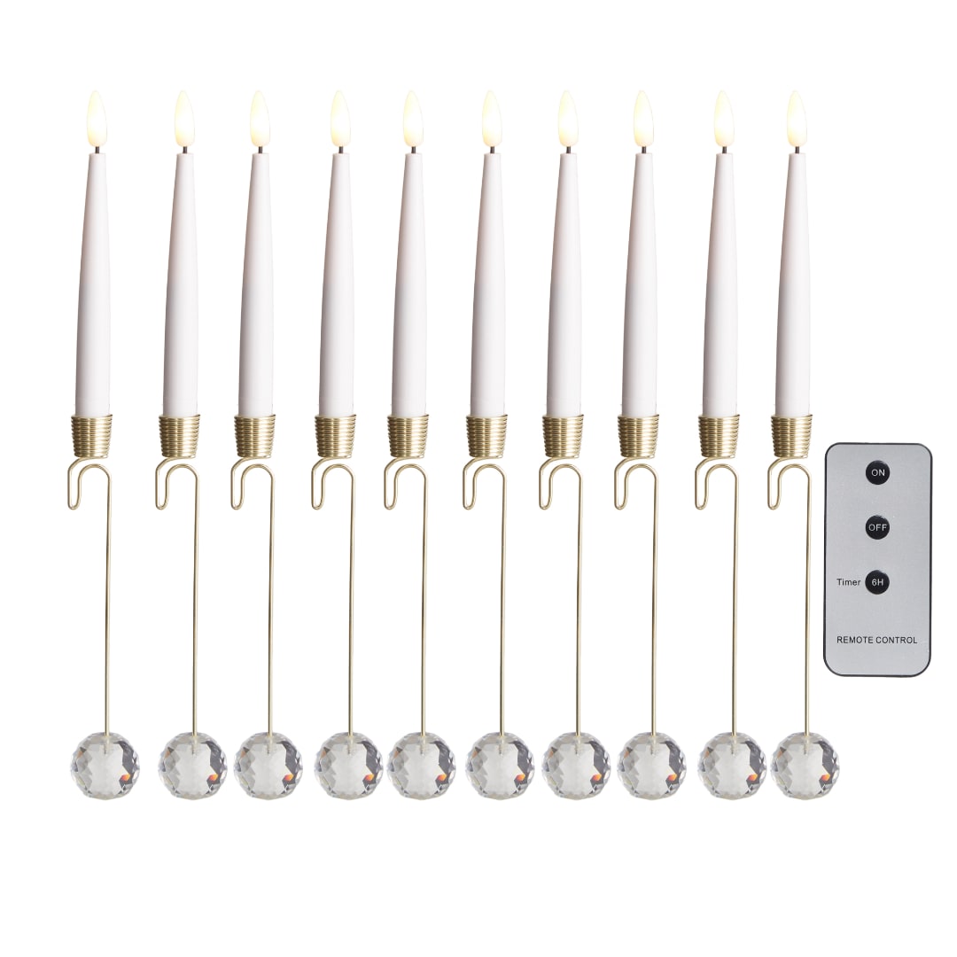 Set of white taper candles with crystal drops and a remote control