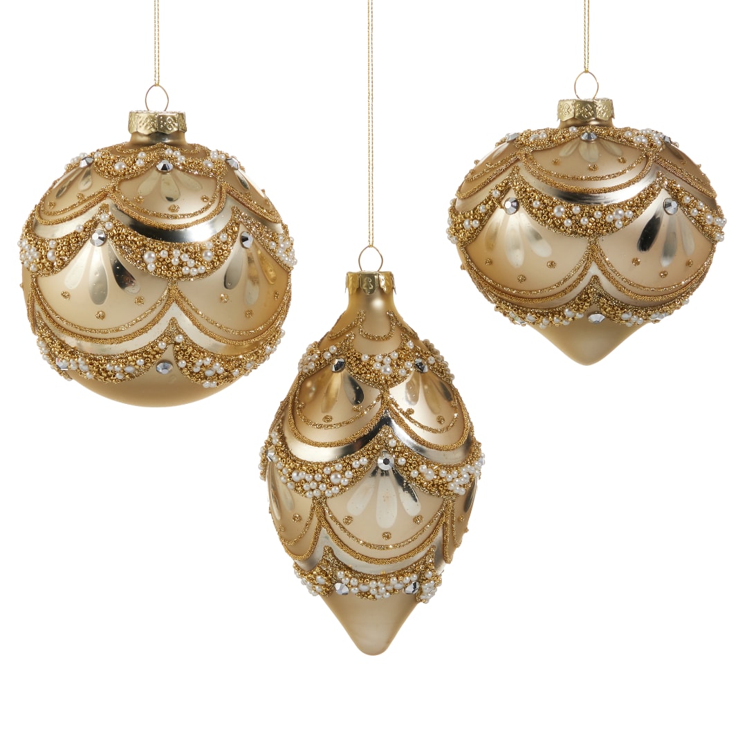 Three gold beaded Christmas ornaments hanging on white background