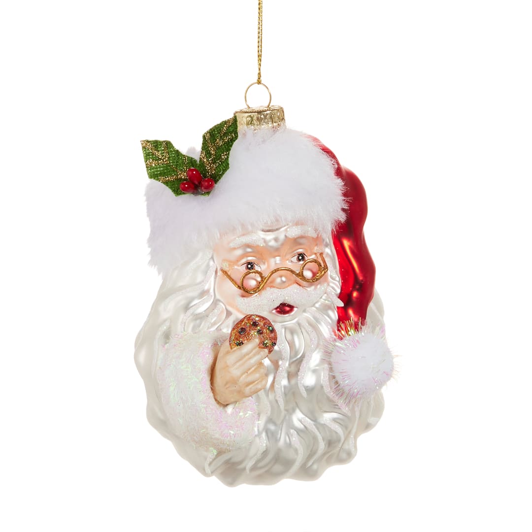 Santa Claus Christmas ornament holding a cookie