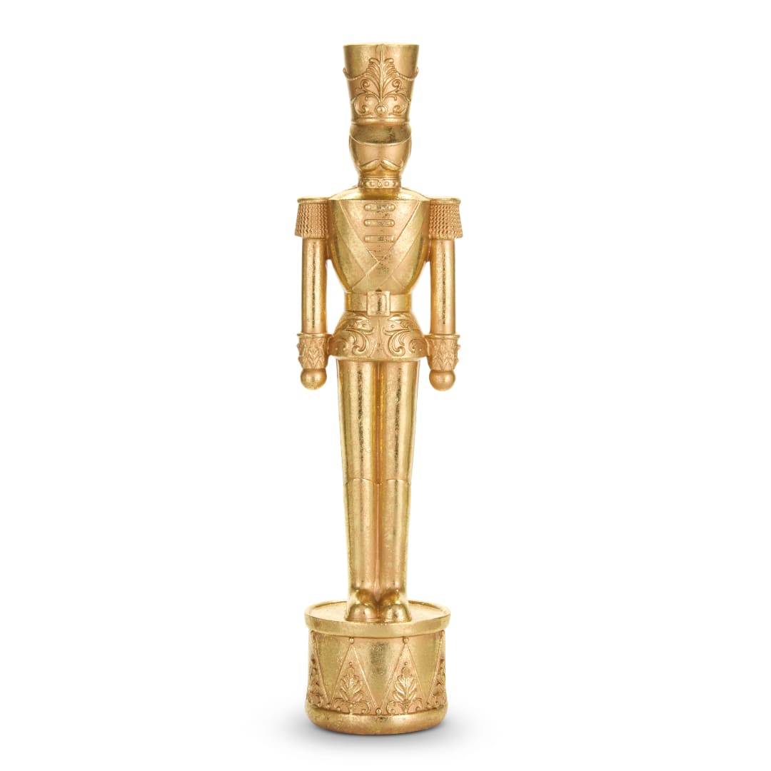 Gold decorative nutcracker figurine standing on a round base