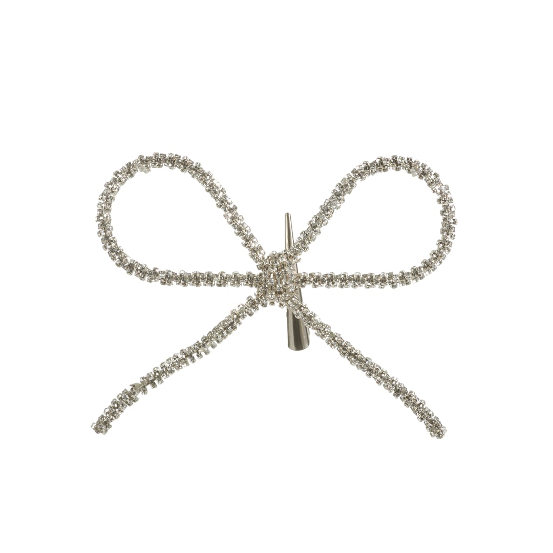 Silver rhinestone bow ornament on a white background