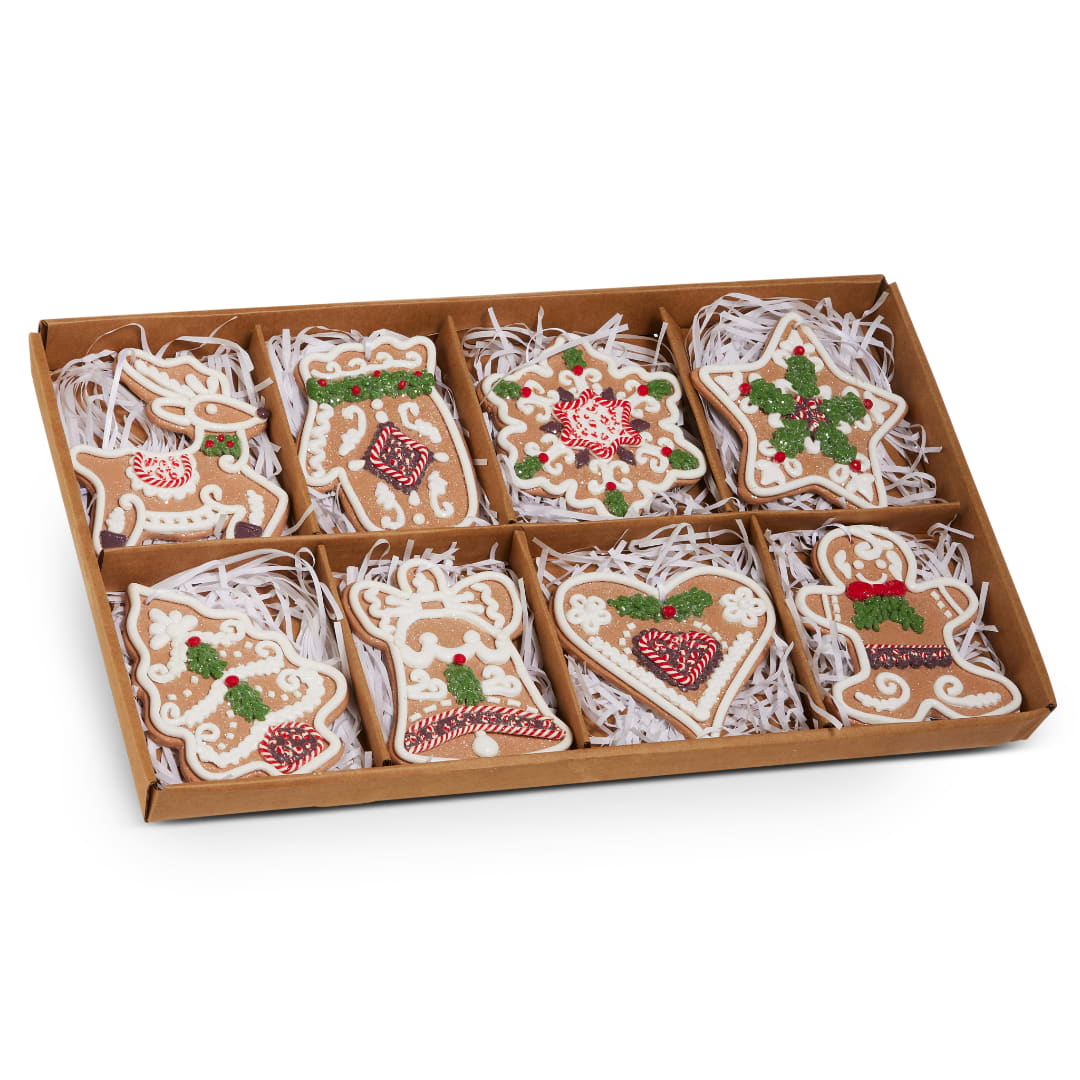 Box of decorated holiday cookies in a divided tray
