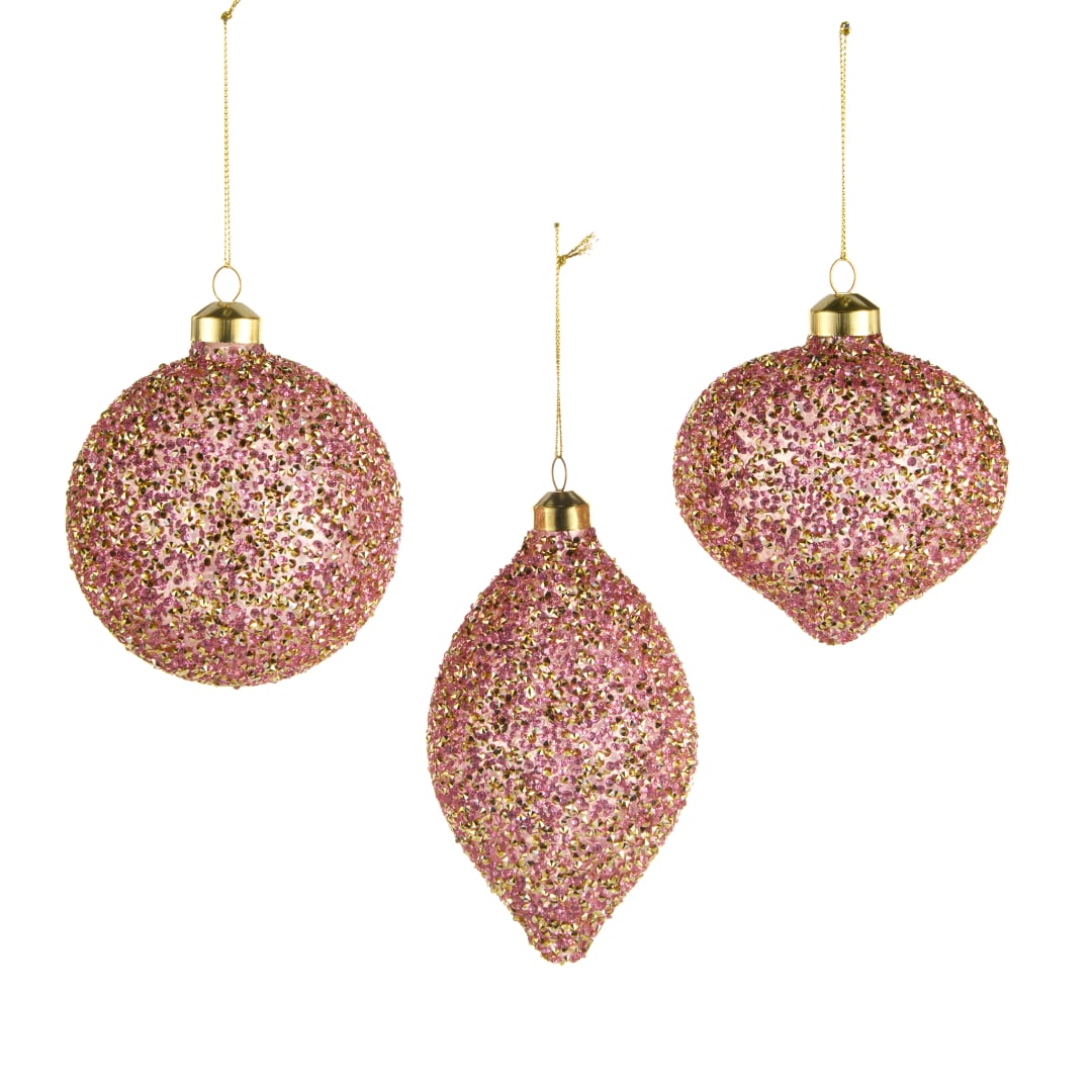 Three pink and gold glitter Christmas ornaments hanging on white