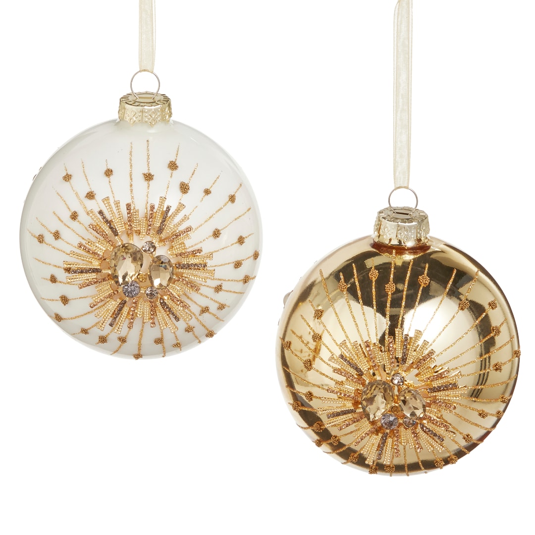 Two gold and white decorative Christmas ornaments with ribbon hangers