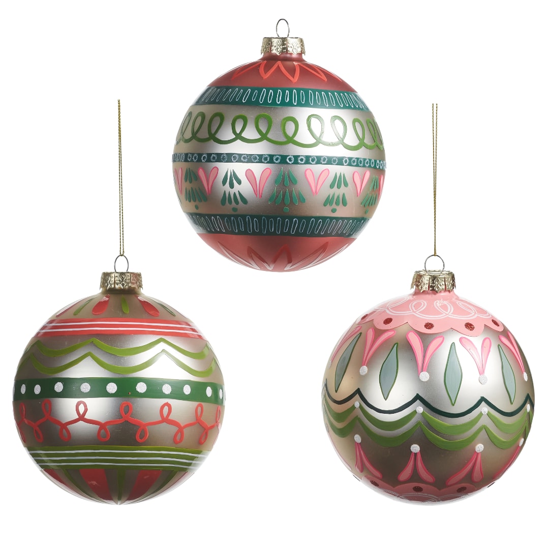 Three decorated Christmas ornament balls with hanging cords