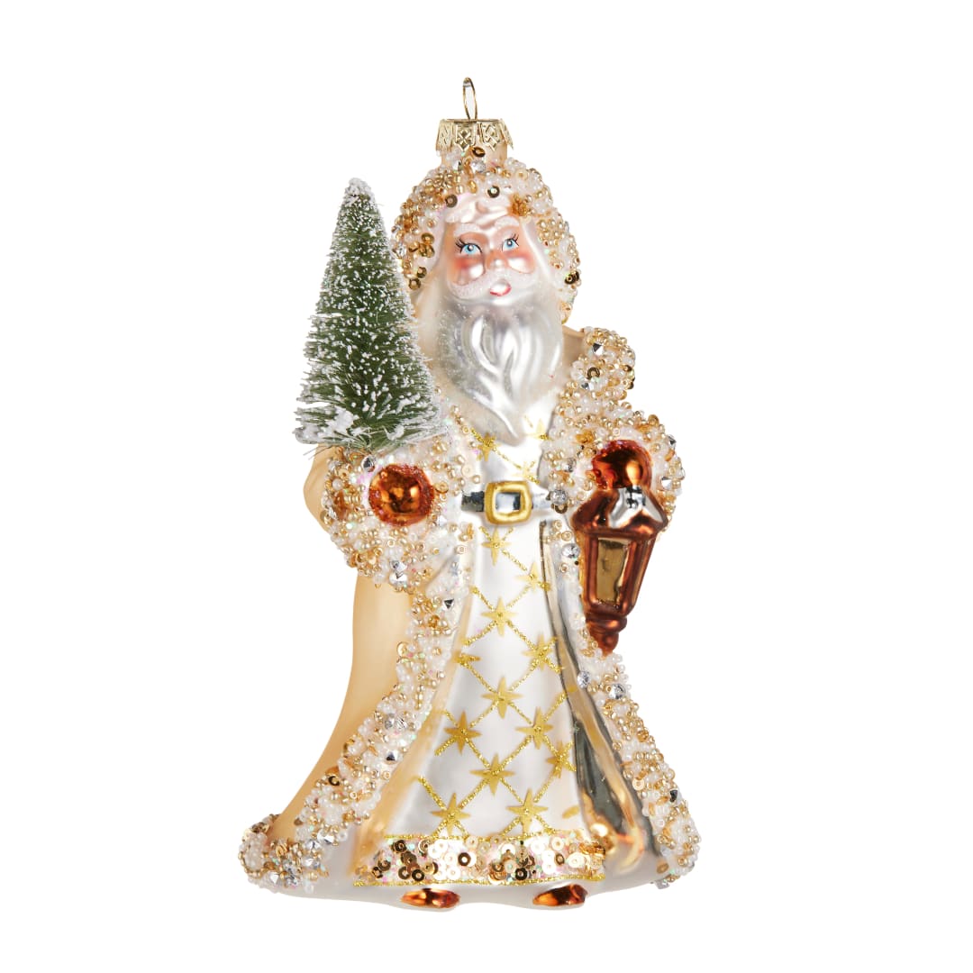 Decorative Santa Claus ornament holding a small tree and lantern