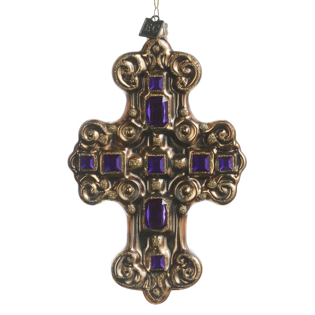 Ornate gold cross ornament with purple gem accents