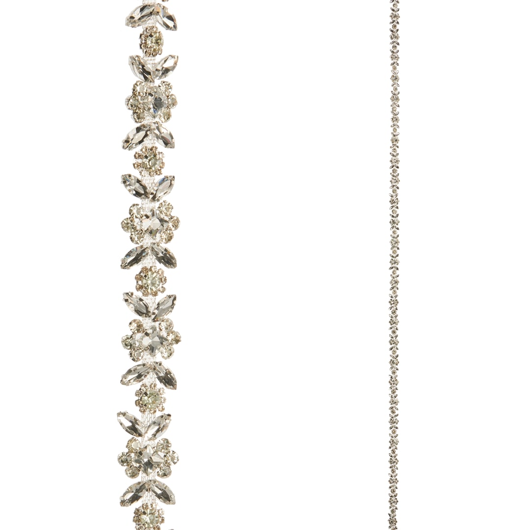 Two crystal floral garlands hang against a white background.