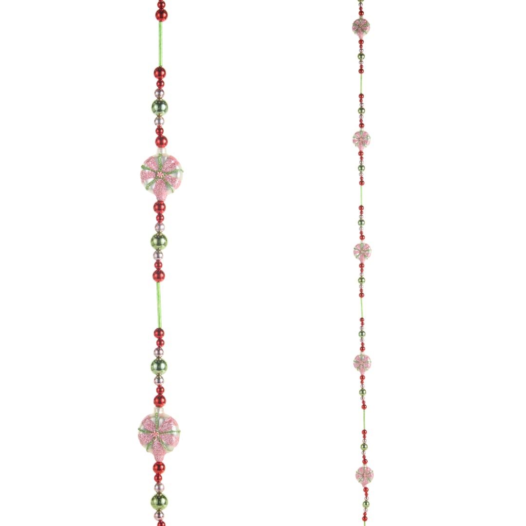 Two hanging strands of red, green, and pink beads on a white background