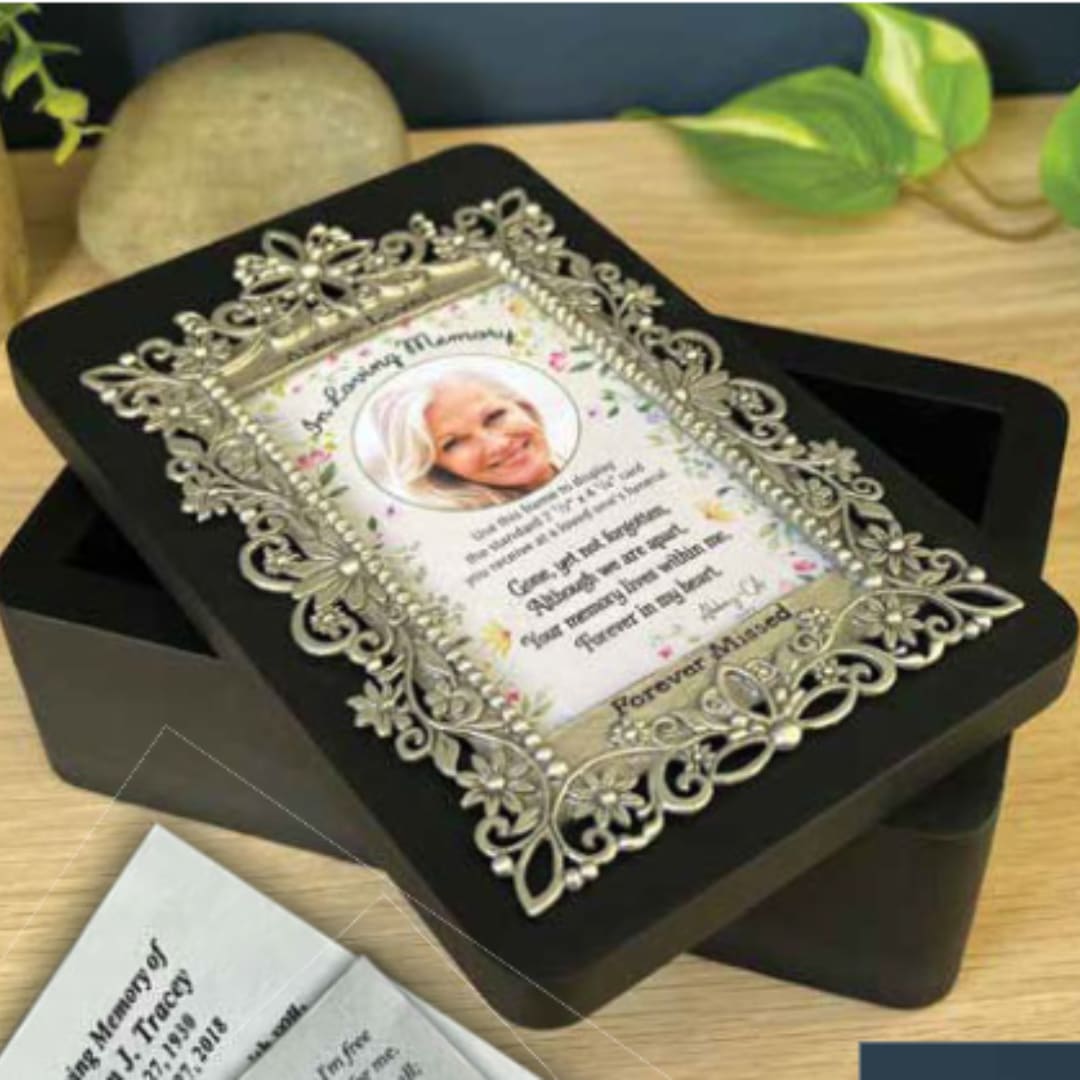 Memorial keepsake box with an ornate framed tribute card