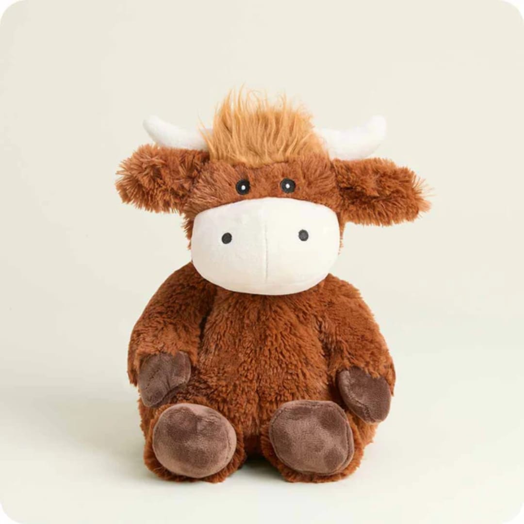 Brown plush cow toy with white face and horns