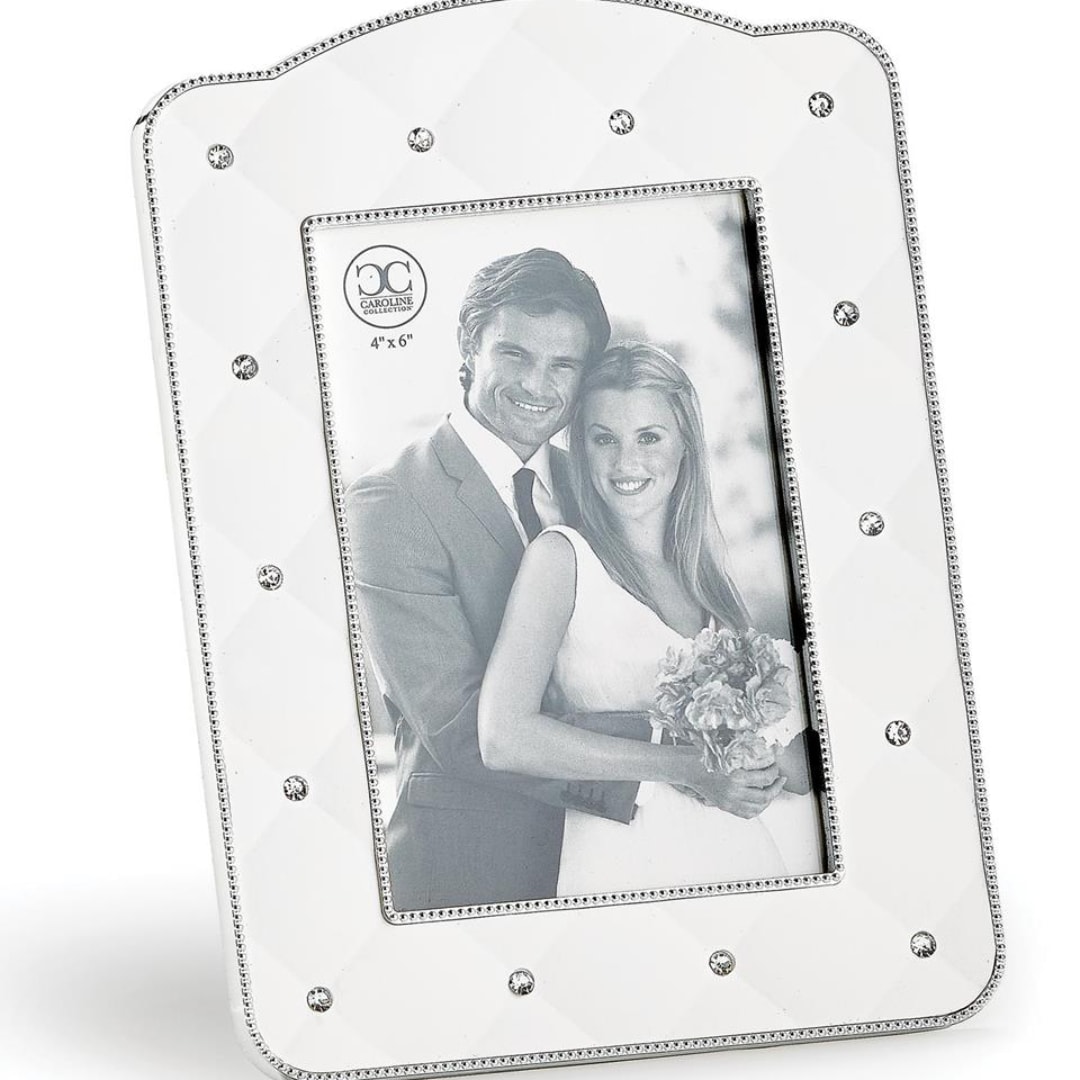 White jeweled photo frame with a couple's portrait inside