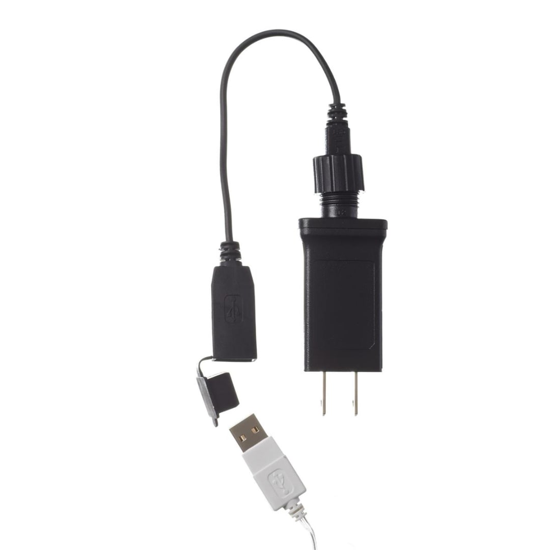 Black USB power adapter with attached cable and USB plug on a white background