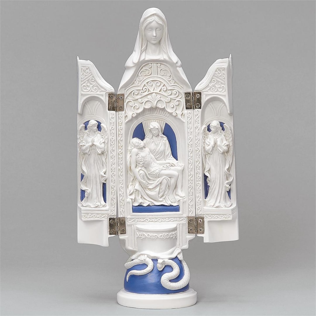 White religious statue with blue accents on a pedestal