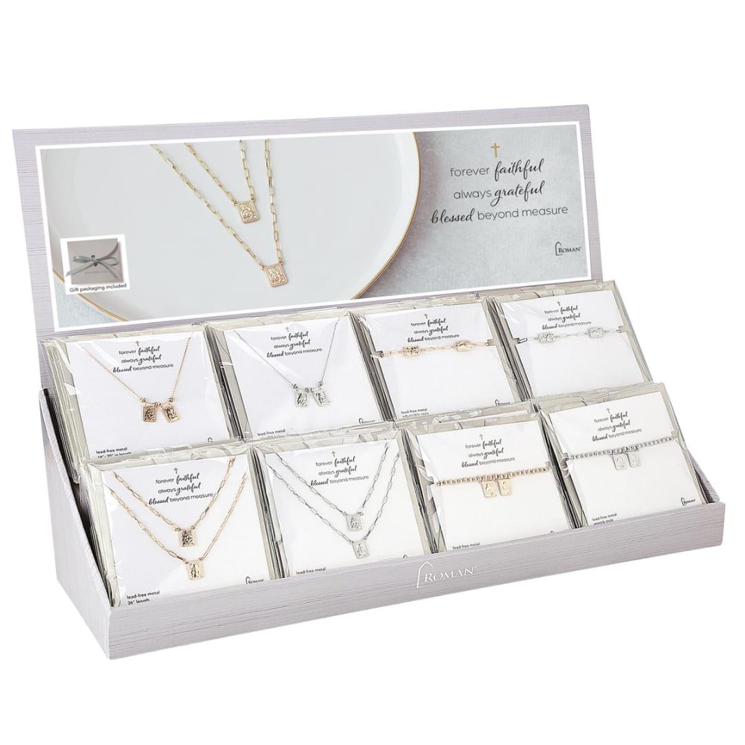 Display box of packaged necklaces with faith-themed cards
