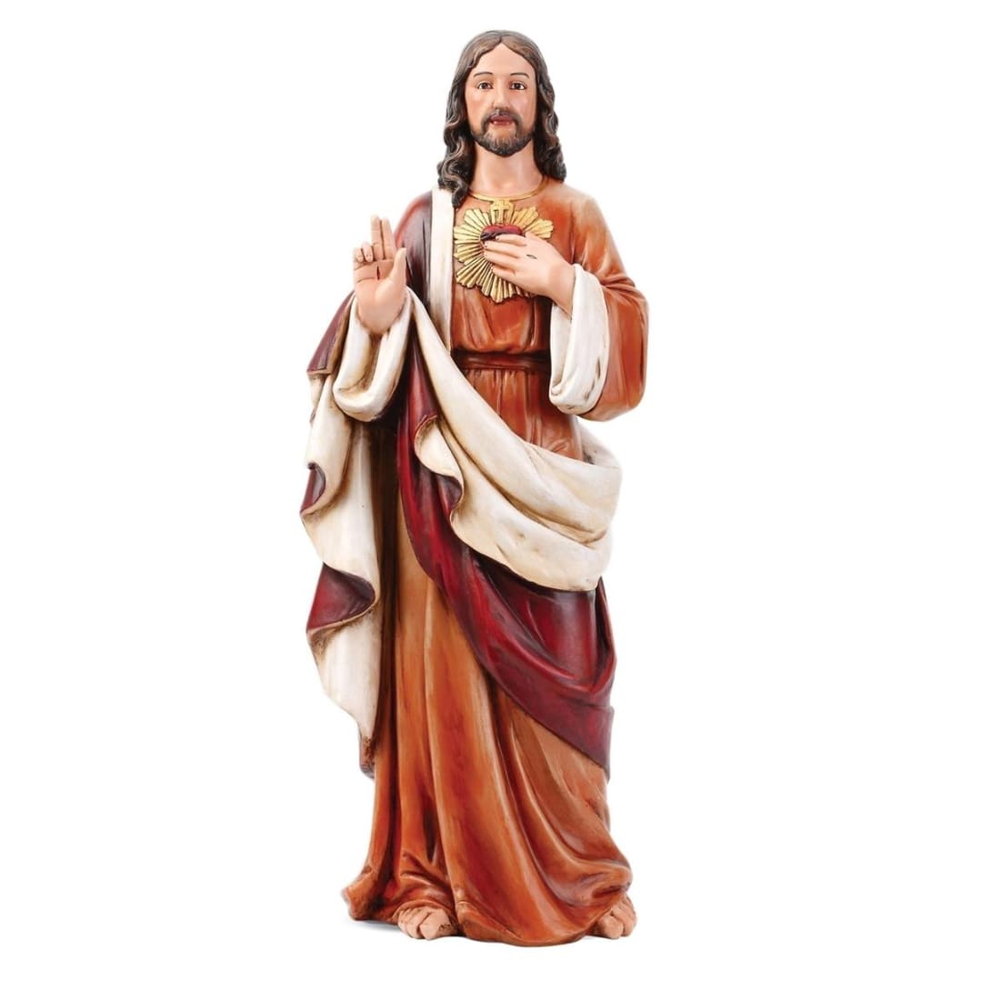 Religious statue of Jesus with a raised hand and sacred heart