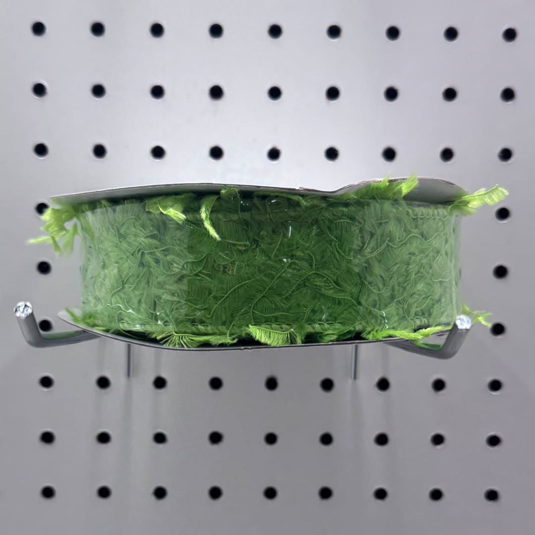 Green mesh ribbon spool on a metal display hook
