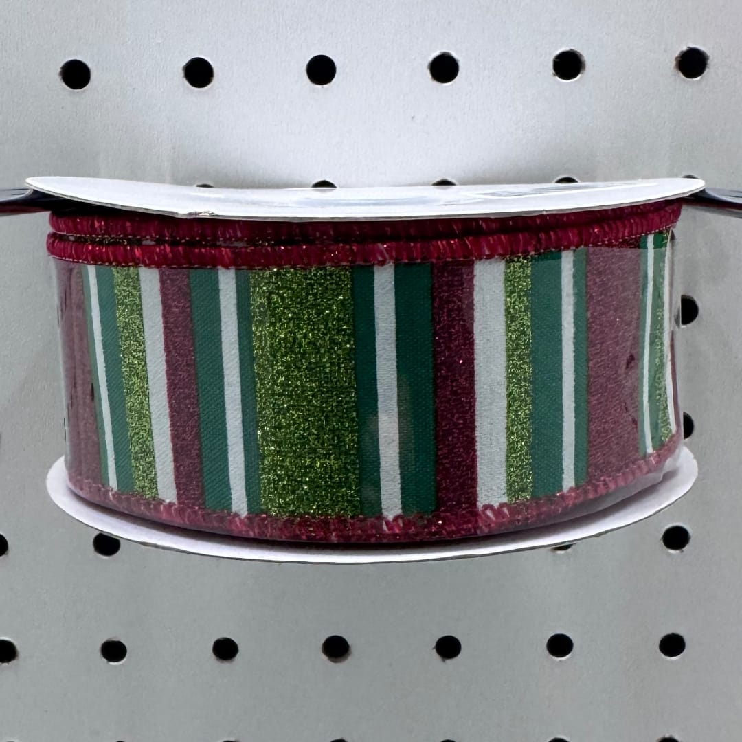 Decorative striped ribbon spool on a pegboard display