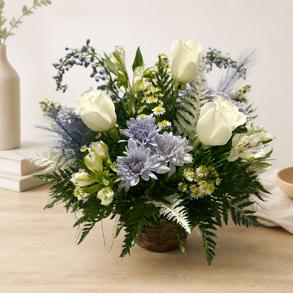White roses and lavender daisies in a woven basket