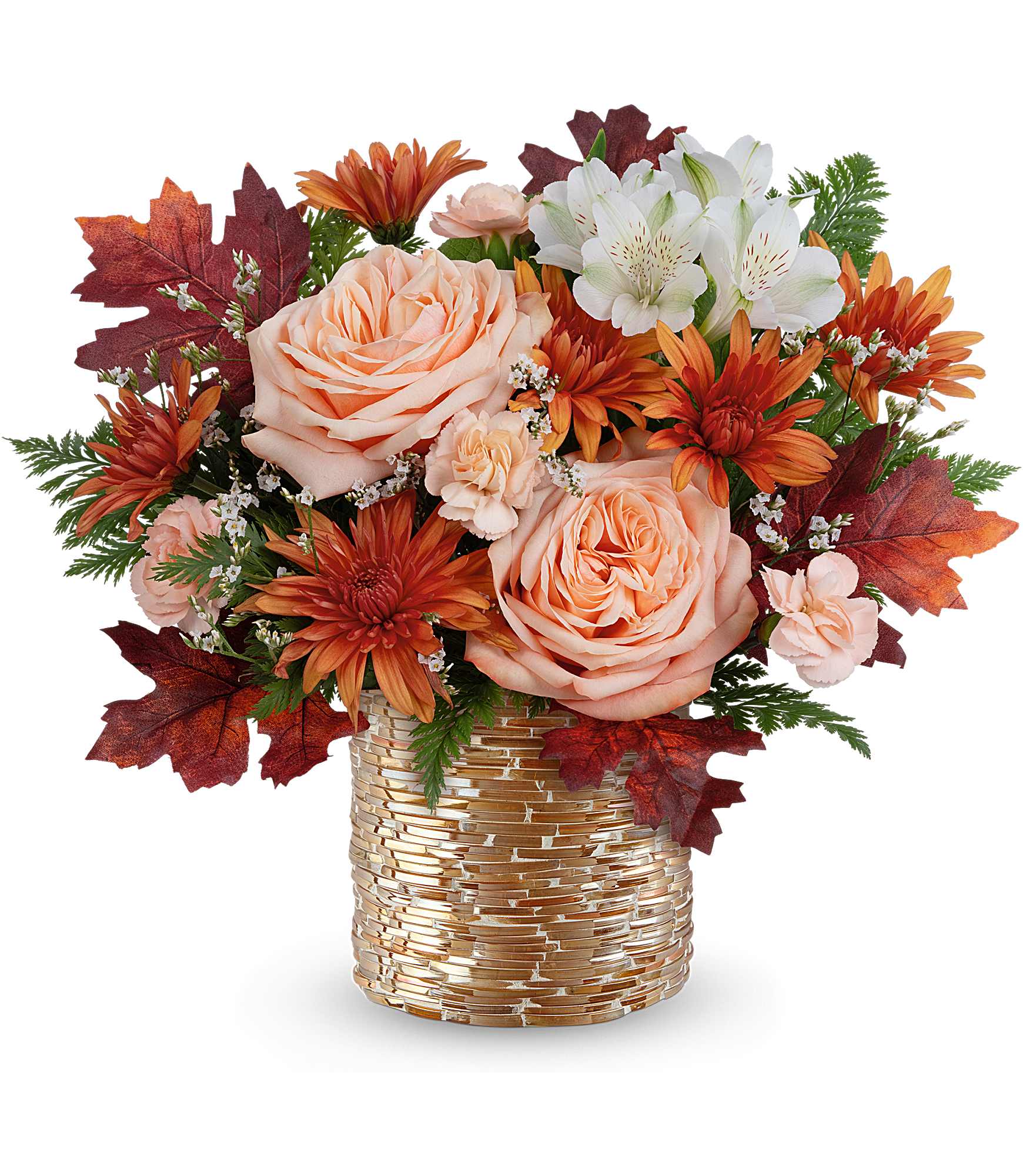 Peach roses and orange daisies in a gold vase with autumn leaves