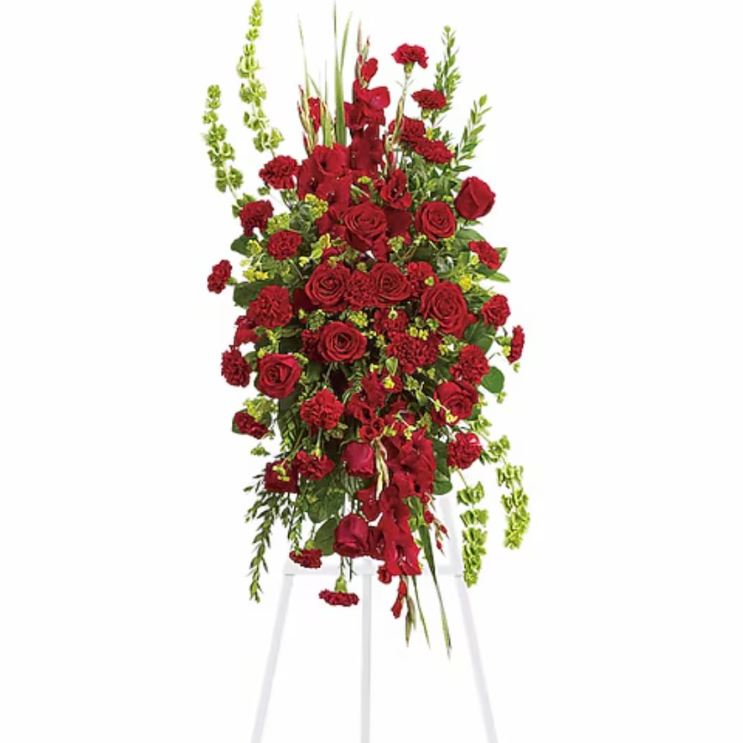 Tall red rose and carnation arrangement on a white stand