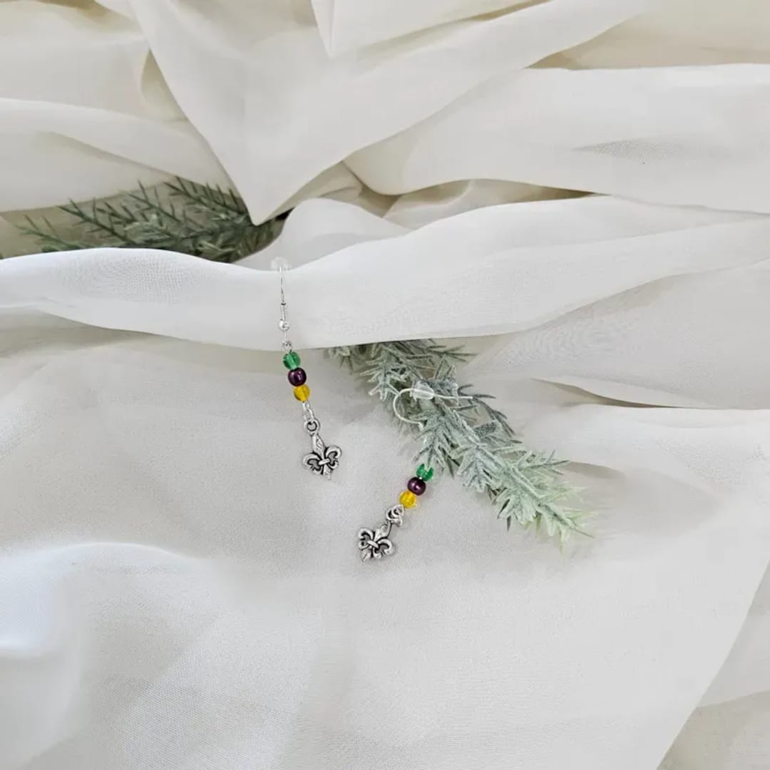 White floral petals with dangling beaded fleur-de-lis charms