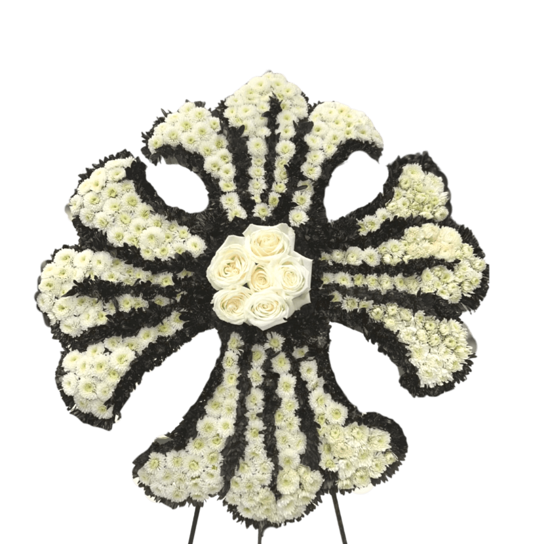 White floral funeral spray with black accents and a cluster of white roses in the center