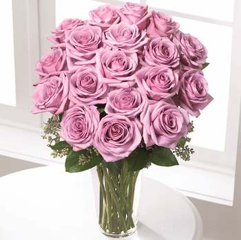 The Lavender Rose Bouquet - Deluxe - An enchanting bouquet of lavender roses sweetly touches her heart. Paired with seeded eucalyptus in a stylish glass vase, these lovely roses are a perfect gift.