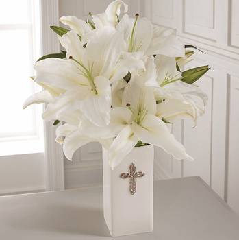 The Faithful Blessings Bouquet - Good - This striking display of pure white lilies will send your heartfelt expressions when words just aren't enough. Arranged in a white ceramic vase and enhanced by a silvertone cross, this arrangement is perfect for First Communion celebrations, confirmations, sympathy, weddings, or a special anniversary.