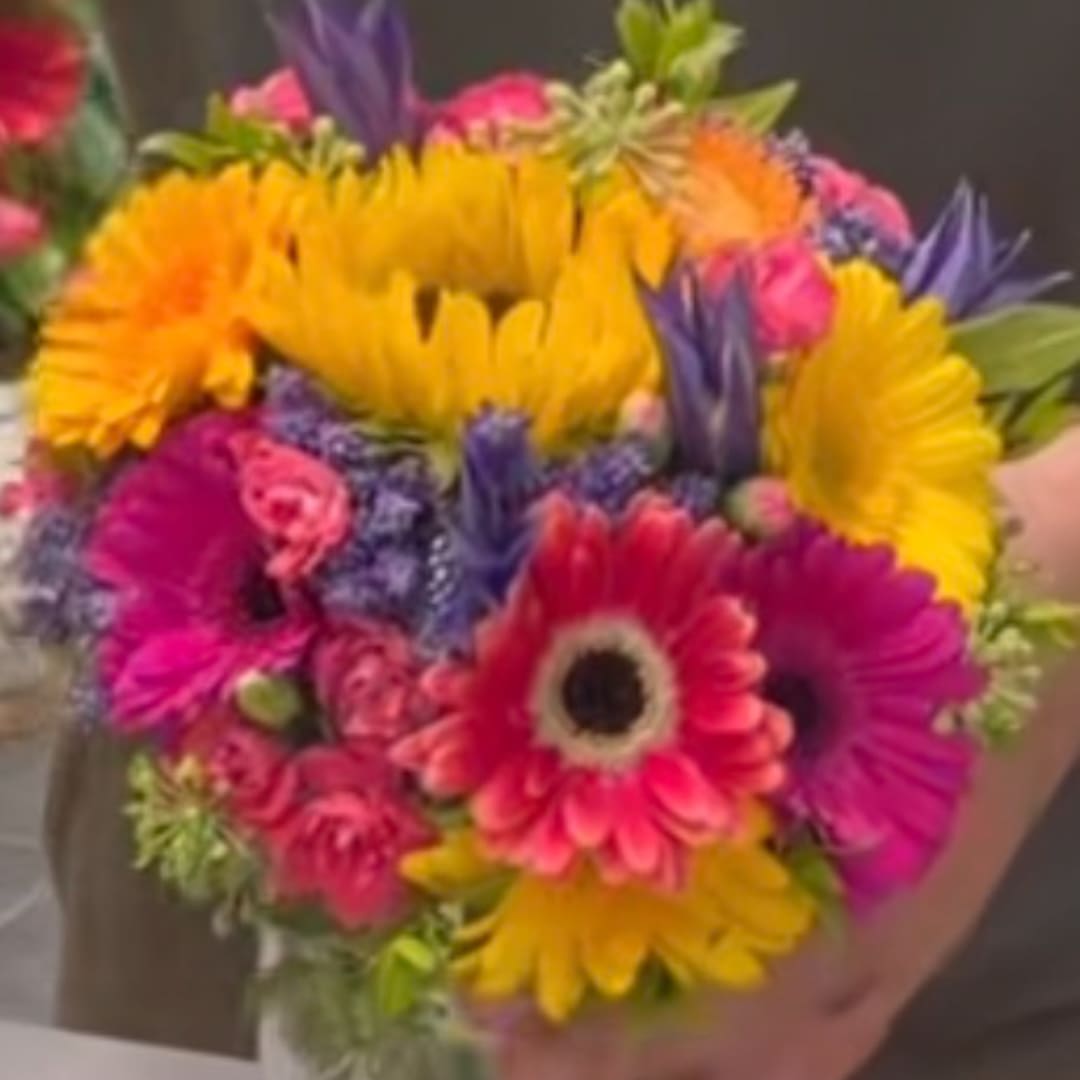 Bright mixed bouquet with gerbera daisies and purple accents