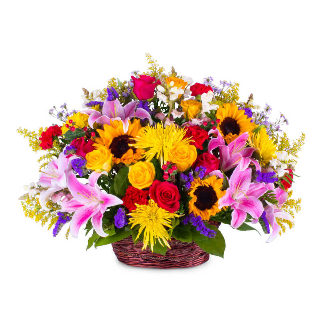 Mixed bouquet of roses, lilies, sunflowers, and daisies in a basket