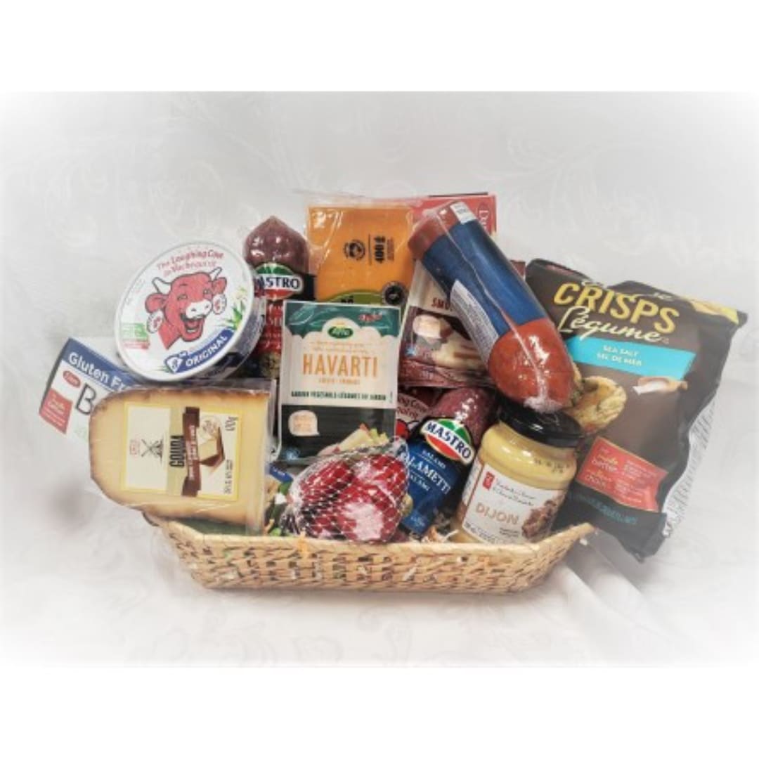 Gift basket with cheeses, sausage, crackers, and mustard
