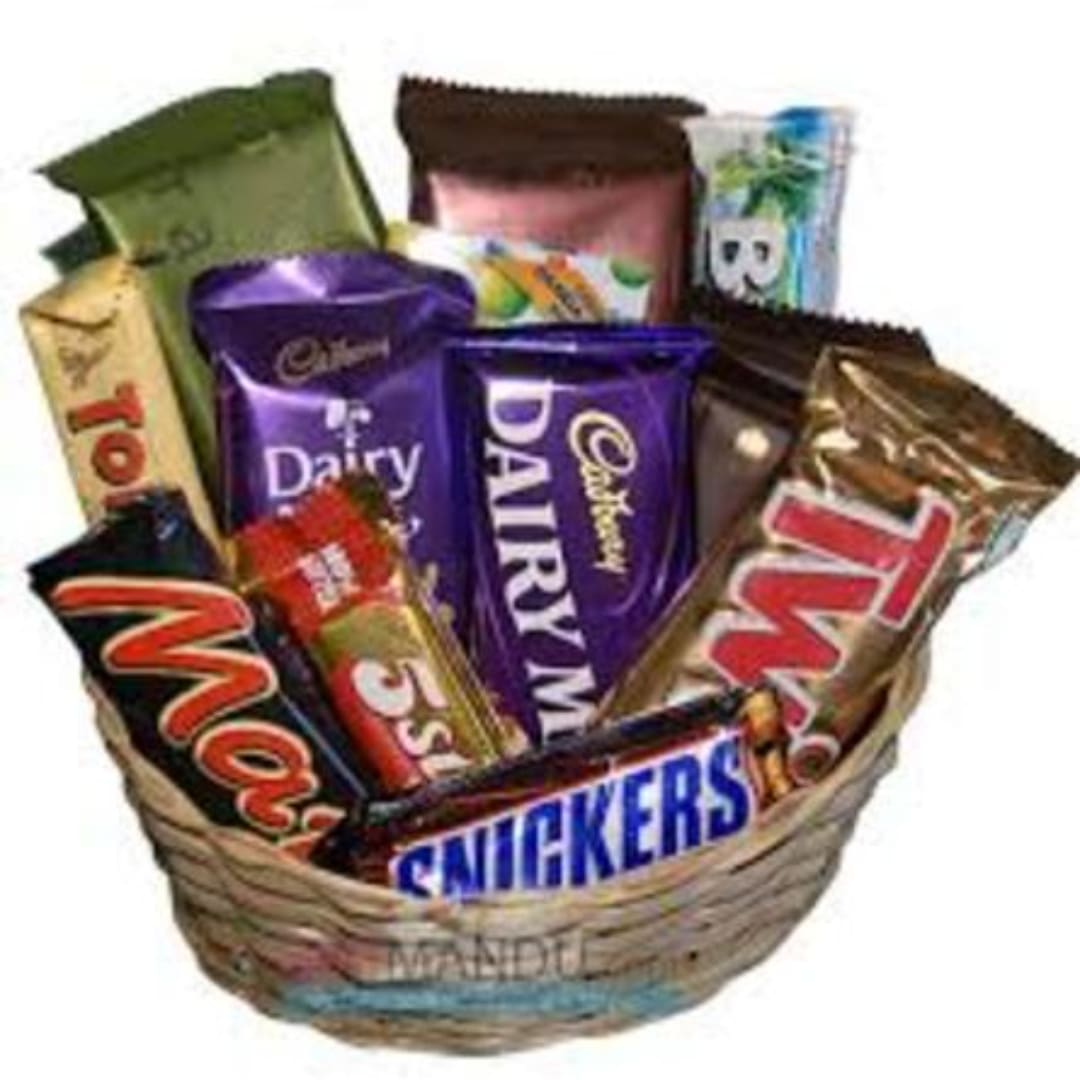 Basket of assorted chocolate bars and candy wrappers