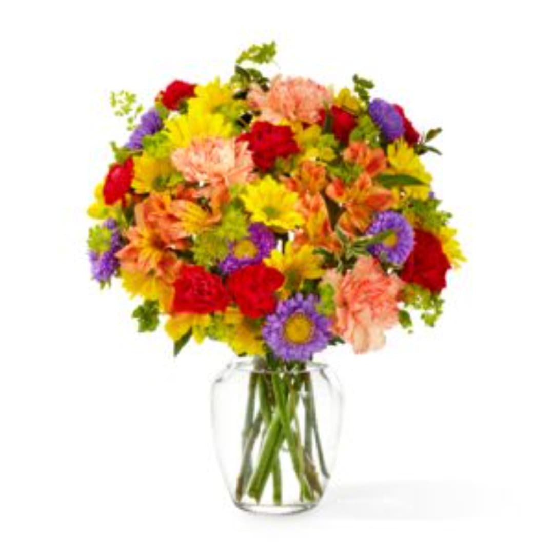 Colorful mixed bouquet in a clear glass vase
