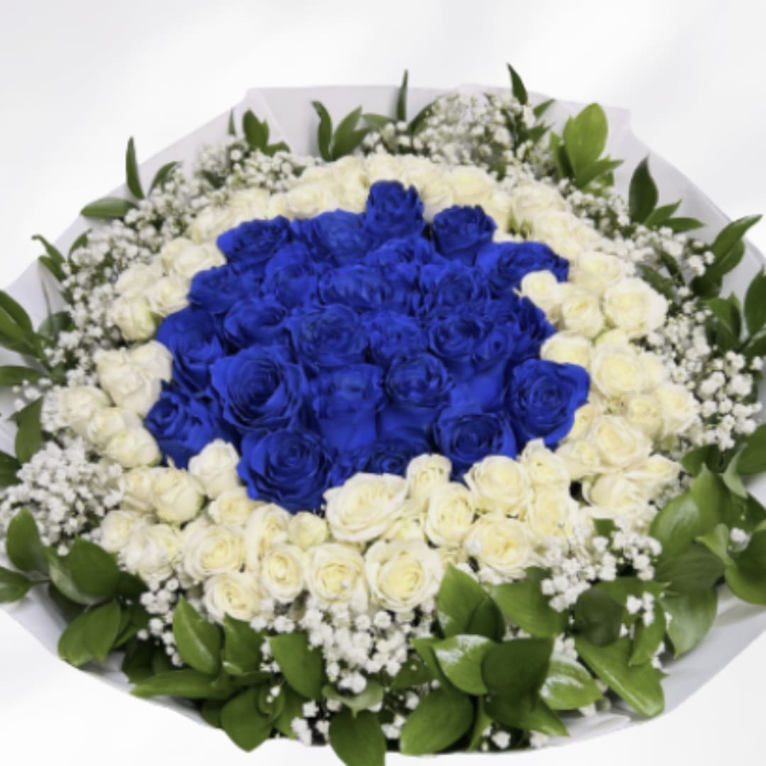 Round bouquet of blue and white roses with baby's breath
