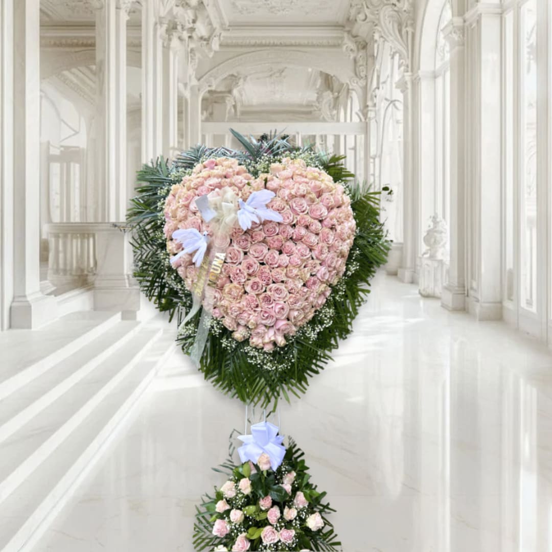 Heart-shaped pink rose standing spray with a smaller floral base