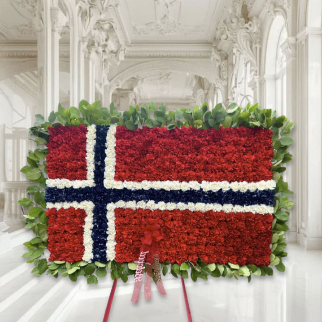 Floral arrangement shaped like the Norwegian flag with red, white, and blue flowers