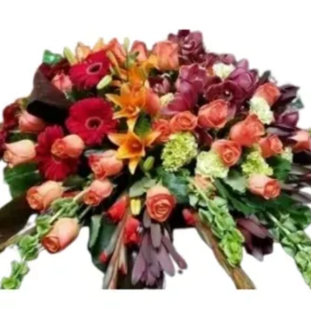 Mixed bouquet of roses, gerbera daisies, and lilies in warm colors