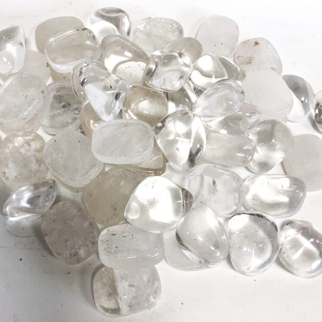 Pile of clear polished stones on a white surface