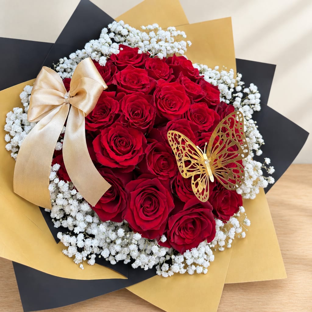 Bouquet of red roses with white baby's breath and gold ribbon accents