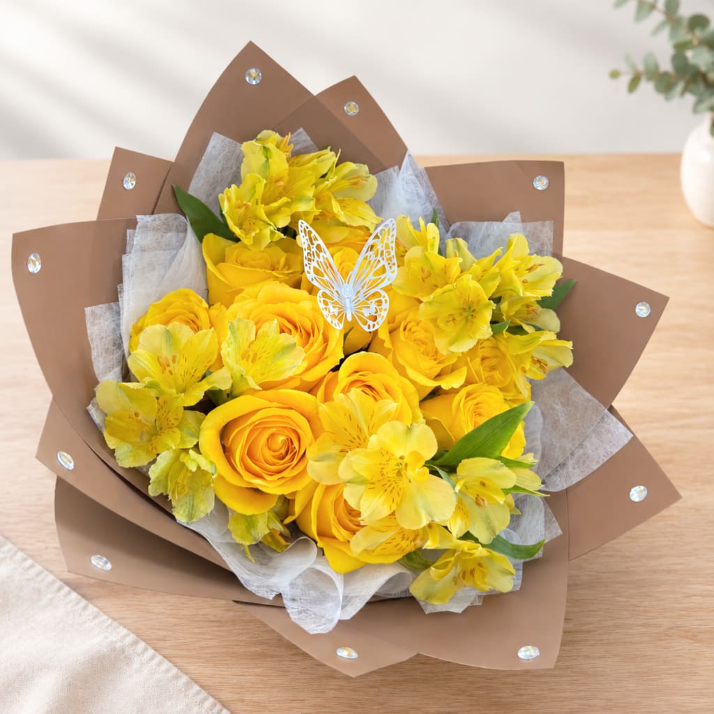 Yellow roses and alstroemeria bouquet wrapped in brown paper