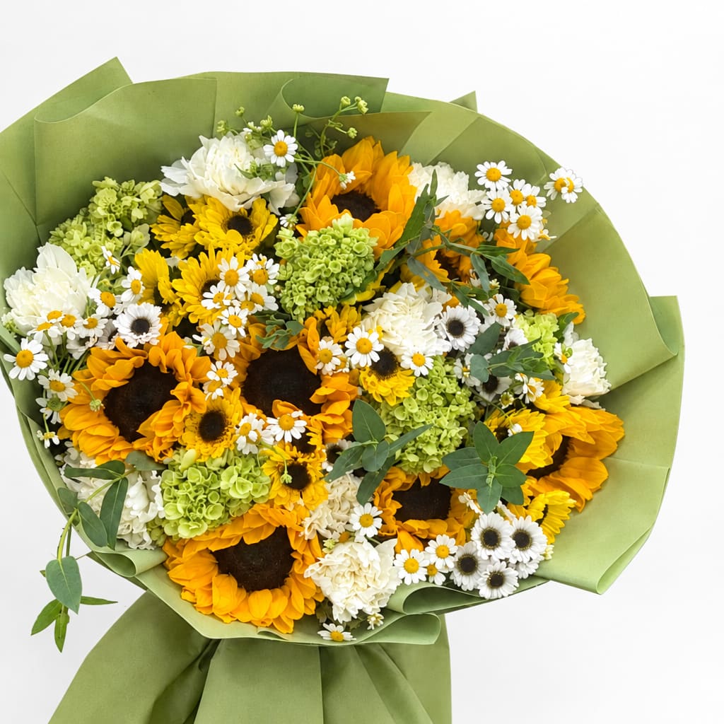Bouquet of sunflowers, white daisies, and green hydrangeas wrapped in green paper