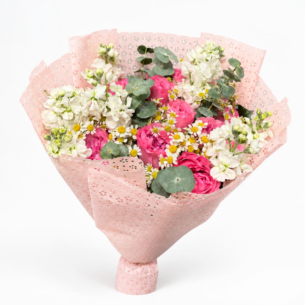 Pink and white mixed bouquet wrapped in pale pink paper