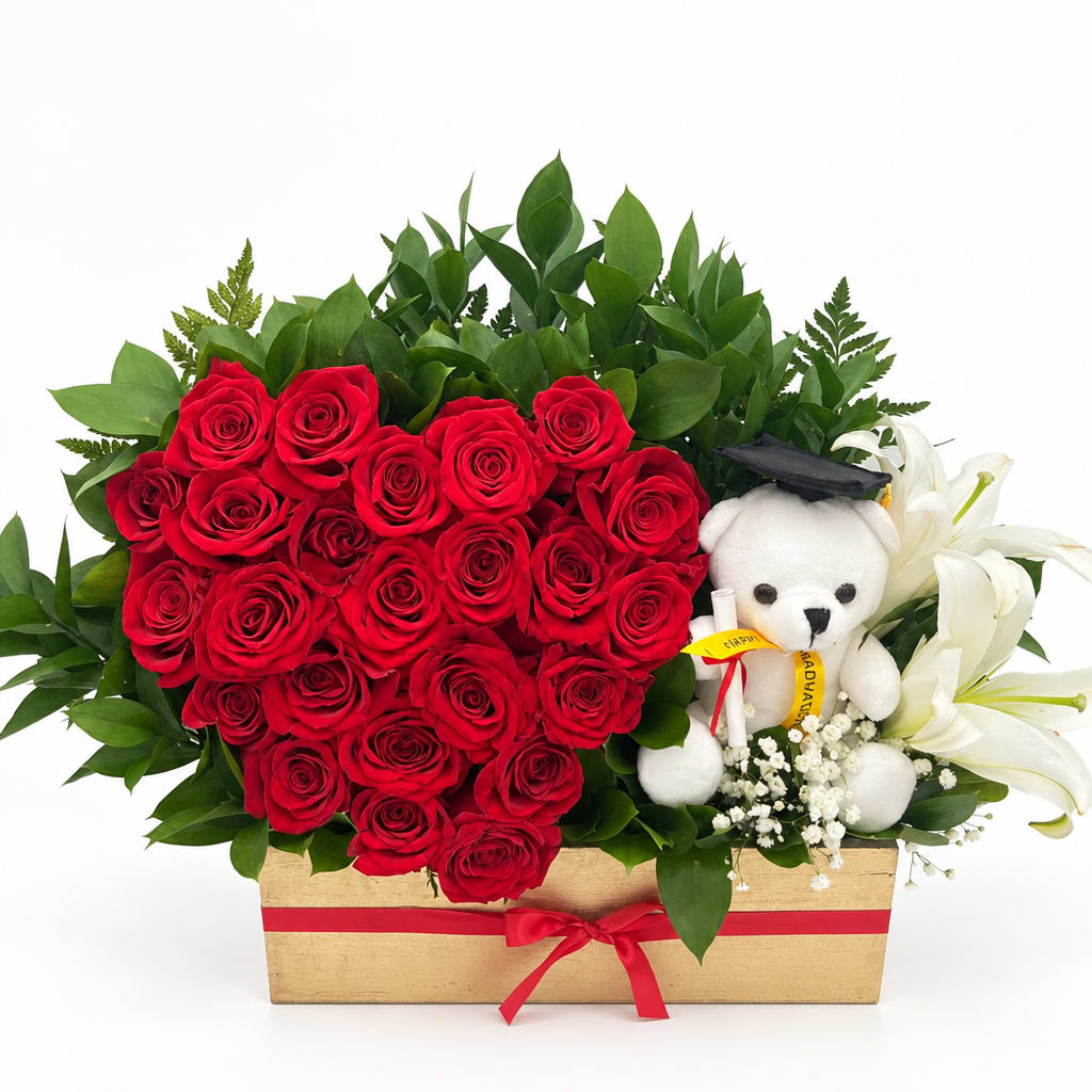 Heart-shaped red rose arrangement with white lilies and a teddy bear in a wooden box