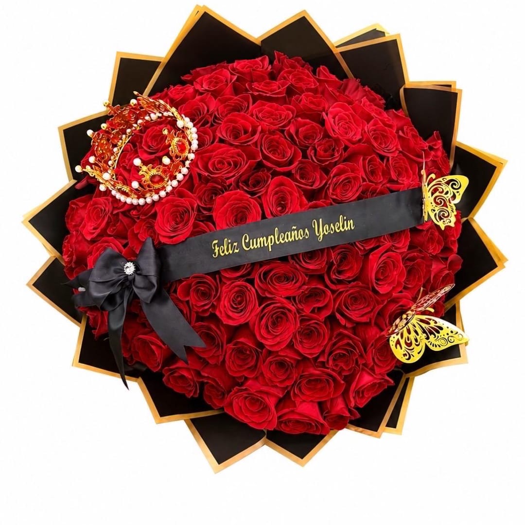 Heart-shaped bouquet of red roses with black and gold wrapping