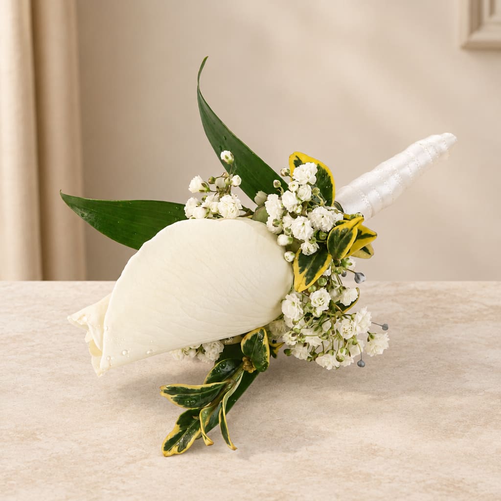 White calla lily bouquet with small white flowers and green-yellow leaves