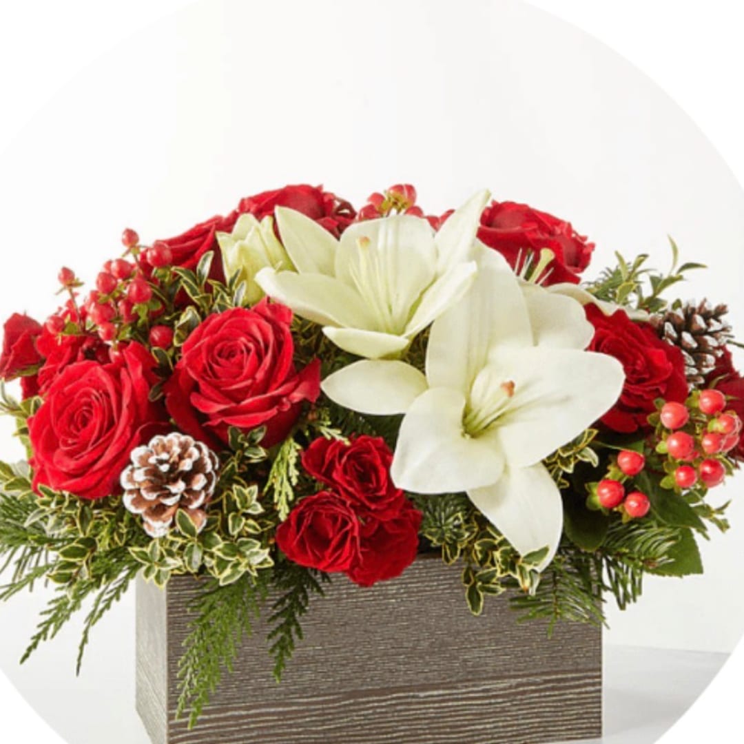 Red roses and white lilies in a rectangular wooden box