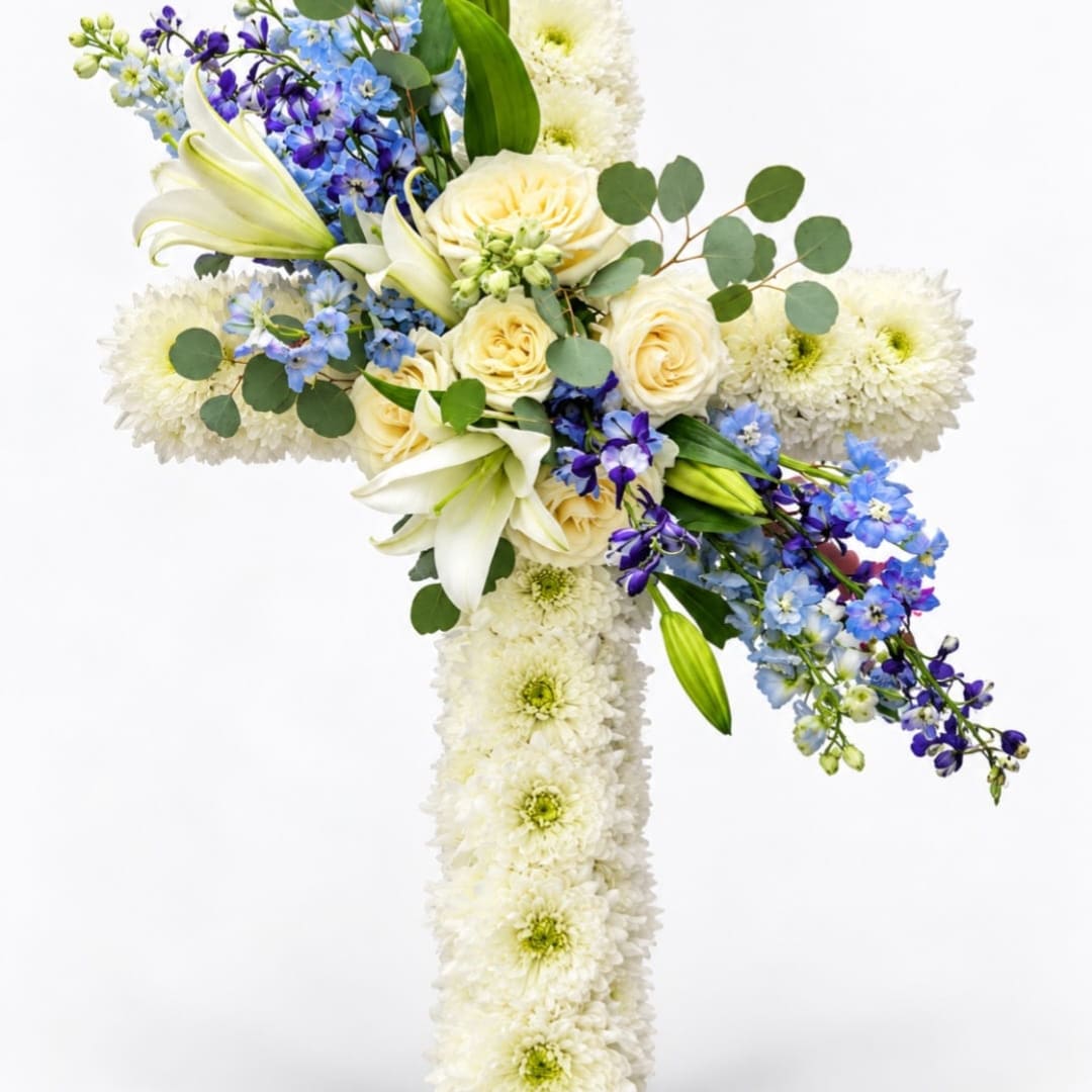 White floral cross with blue and cream flowers