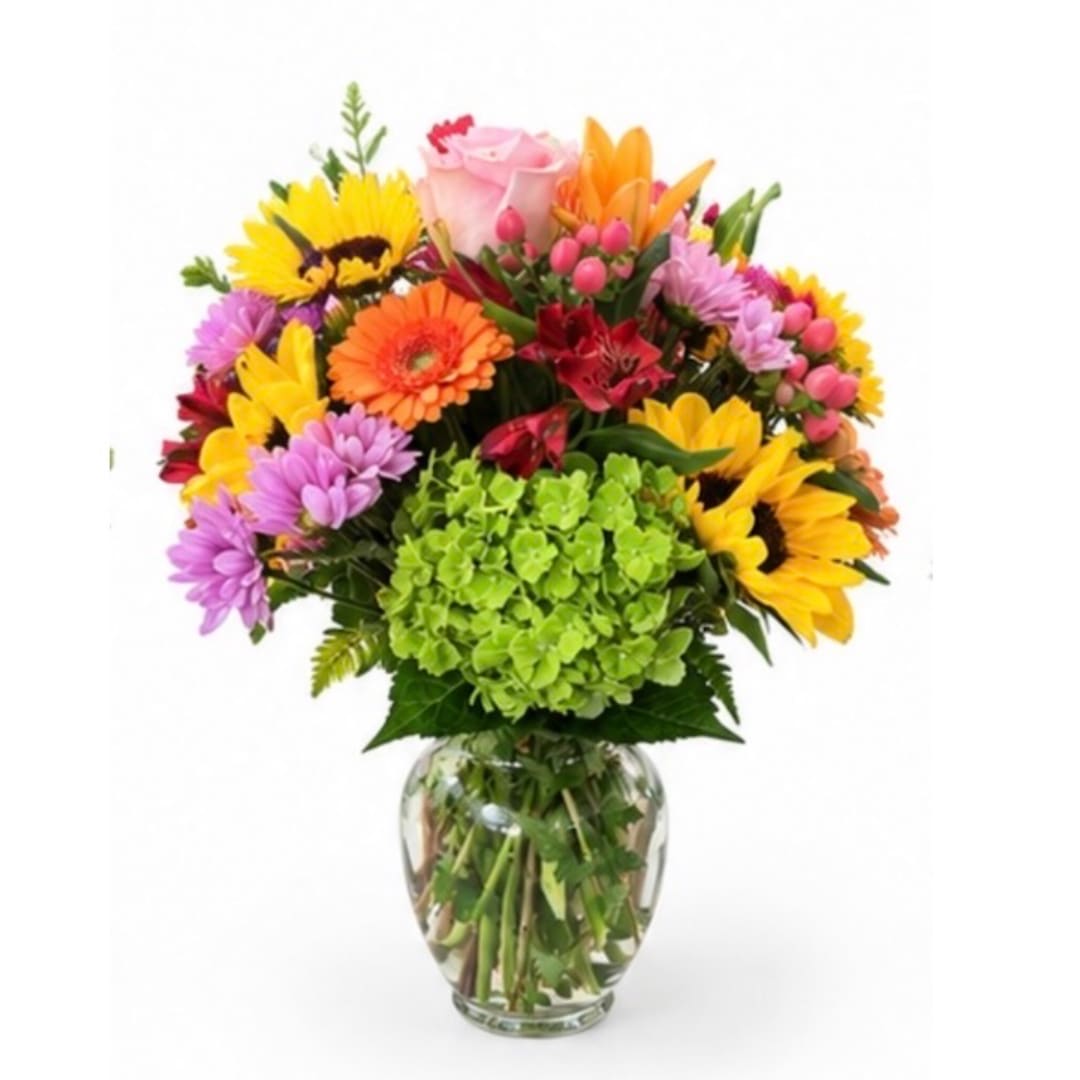 Colorful mixed bouquet in a clear glass vase